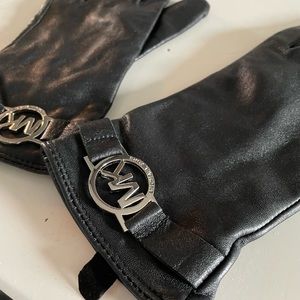 Black leather Michael Kors gloves.